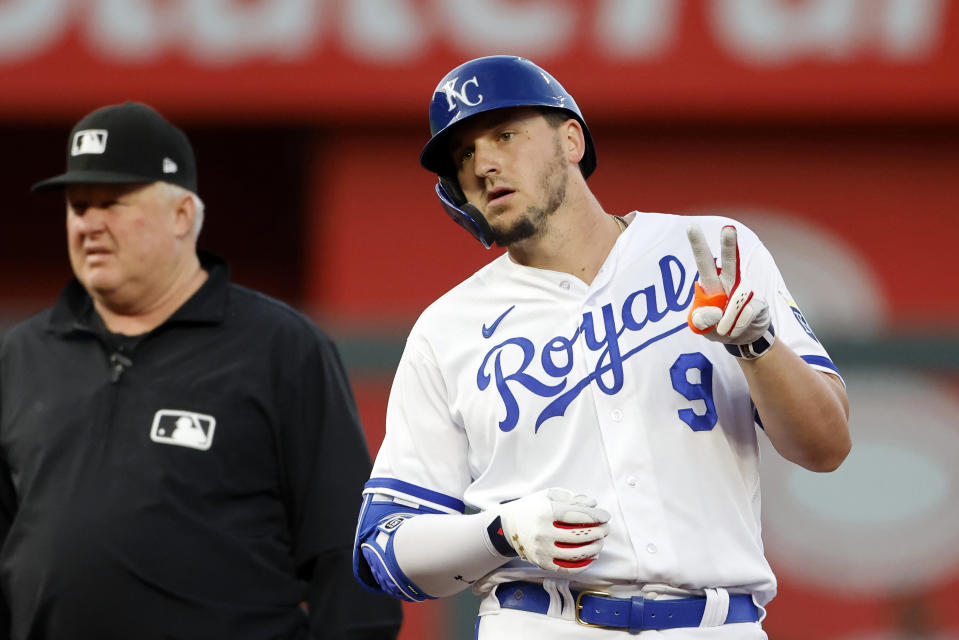Kansas City Royals Vinnie Pasquantino (9) reacts after hitting an RBI double next to second base umpire Bill Miller, left, during the sixth inning of a baseball game in Kansas City, Mo., Wednesday, May 3, 2023. (AP Photo/Colin E. Braley)