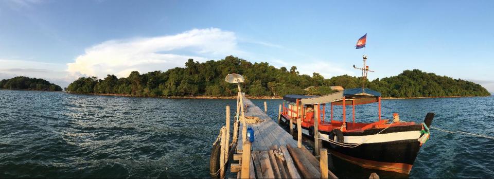 In this Nov. 26, 2016, photo, a wooden boat anchors at a pier off Koh Ach Seh island where a basecamp of conservationists fight to save the rapidly-disappearing seahorses of Cambodia, near the Cambodia-Vietnam border. The much-loved figure of ancient legends has been around for 40 million years but is now being ruthlessly exploited for Asian traditional medicine. (AP Photo/Heng Sinith)