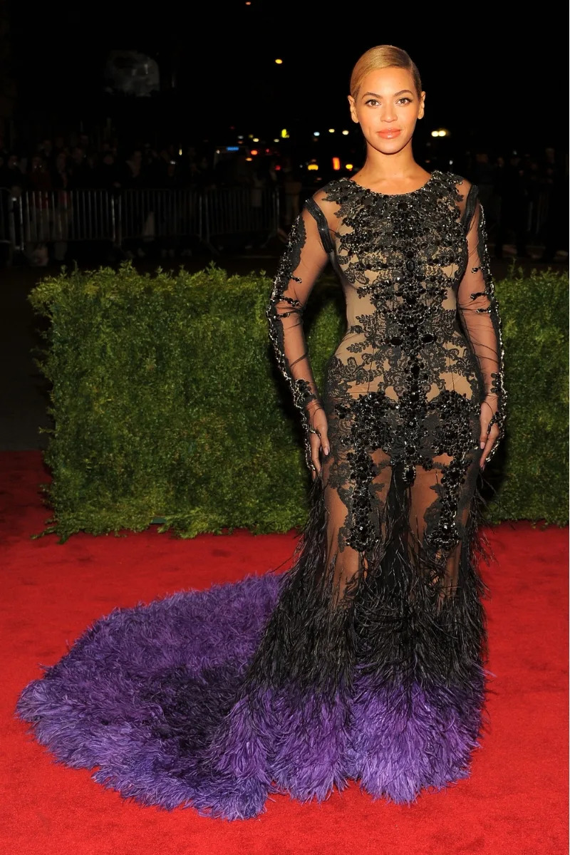 Beyonce wears a black and purple gown as she attends the 
