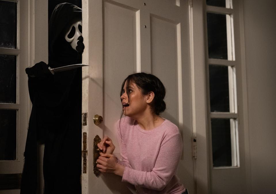 Tara (Jenna Ortega) tries to fend off a home invasion by Ghostface in "Scream."