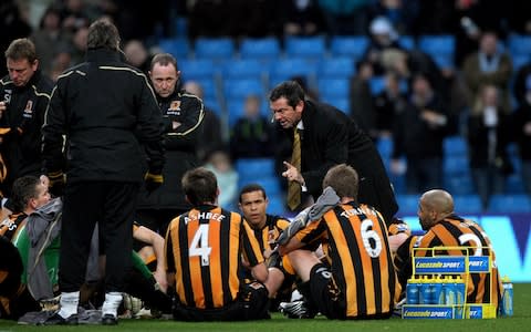 Phil Brown gave his Hull players a half-time team talk on the pitch - Credit: PA
