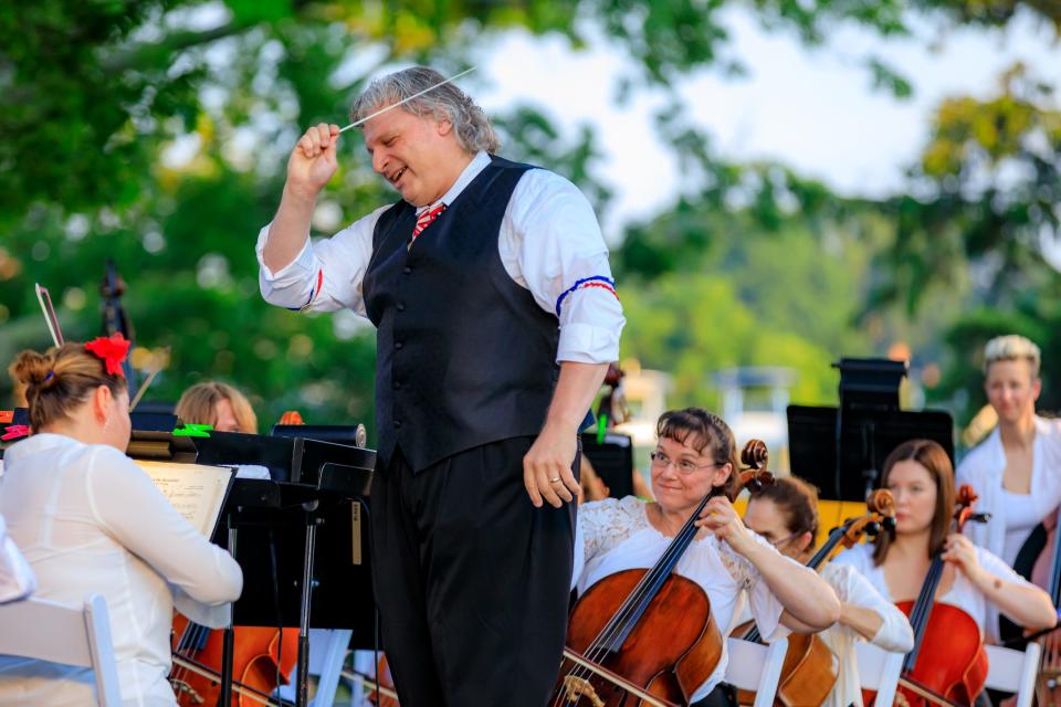 Steven Karidoyanes conducts the Plymouth Philharmonic Orchestra's Independence Day celebration in 2019.