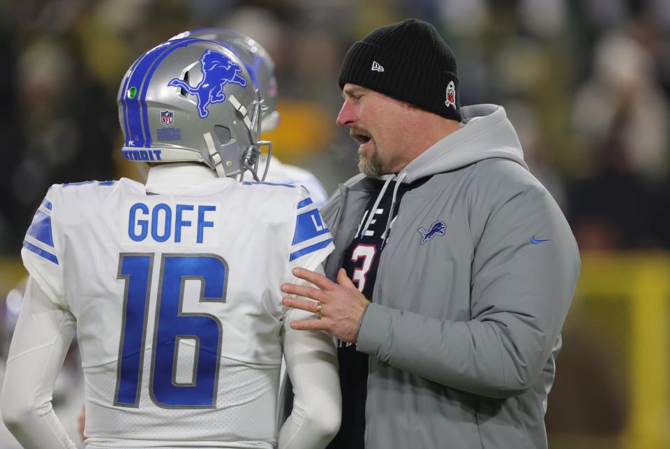 Lions coach Dan Campbell and quarterback Jared Goff talk before the game against the Packers on Sunday, Jan. 8, 2023, in Green Bay, Wisconsin.