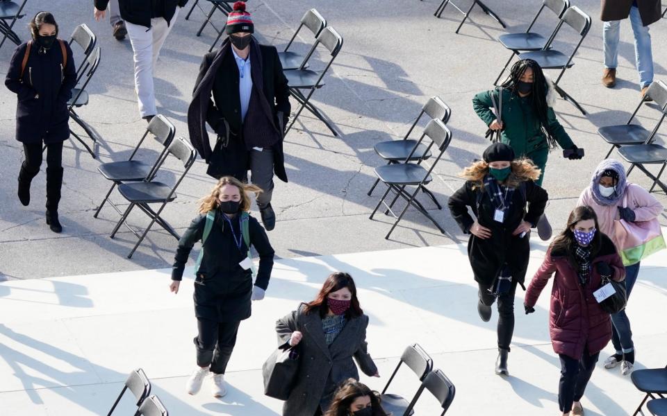 People evacuate from the West Front of the U.S. Capitol during a rehearsal - Carolyn Kaster /AP