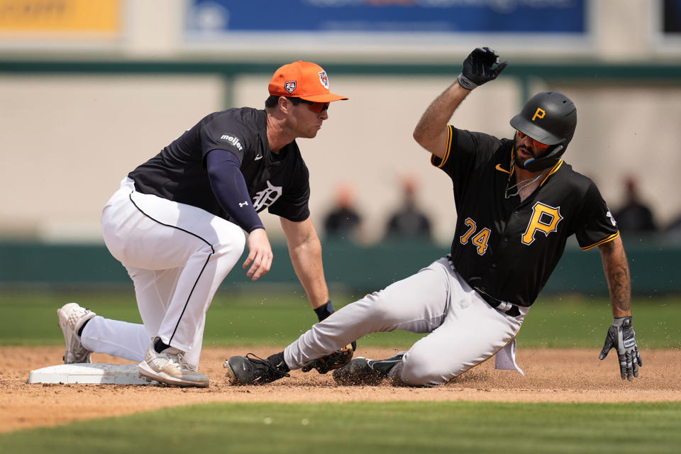 Pittsburgh Pirates Joe Perez is tagged out Detroit Tigers second baseman Colt Keith, left, while trying to steal second base in the fourth inning of a spring training baseball game Saturday, March 9, 2024, in Lakeland, Fla. (AP Photo/Charlie Neibergall)