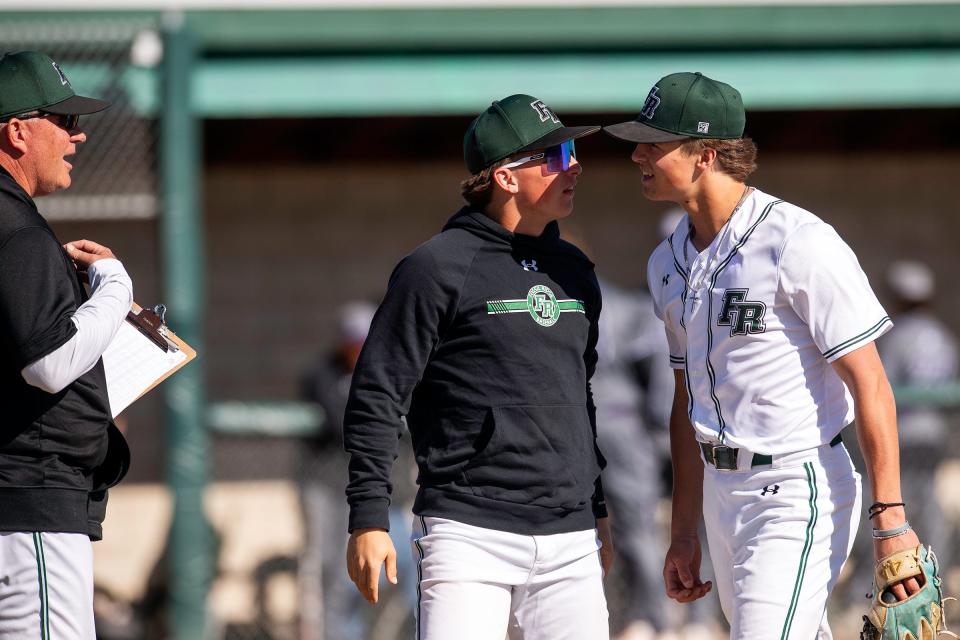 Fossil Ridge's Easton Miller celebrates after coming off the mound during a city rivalry baseball game against Fort Collins on Tuesday at Fossil Ridge High School in Fort Collins.