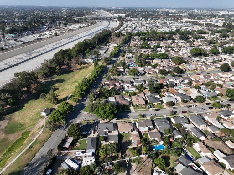 Long Beach, CA - October 05: An aerial view of the Los Angeles River west of DeForest Park in North Long Beach and the neighborhood east of the river and park in Long Beach, Wednesday, Oct. 5, 2022. A new UCI study warns that a major food would hit Los Angeles County's low-lying Black communities disproportionately hard. Working-class neighborhoods adjacent to the Los Angeles River in North Long Beach, for example, would be under six feet of water. (Allen J. Schaben / Los Angeles Times)