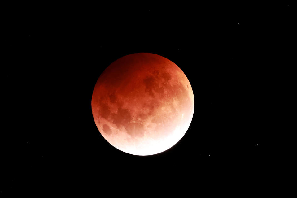 The total lunar eclipse is seen on May 26, 2021, in Auckland, New Zealand. / Credit: Phil Walter/Getty Images