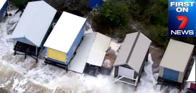 Beach boxes hit by strong surf at Mt Martha Beach. Photo: 7News