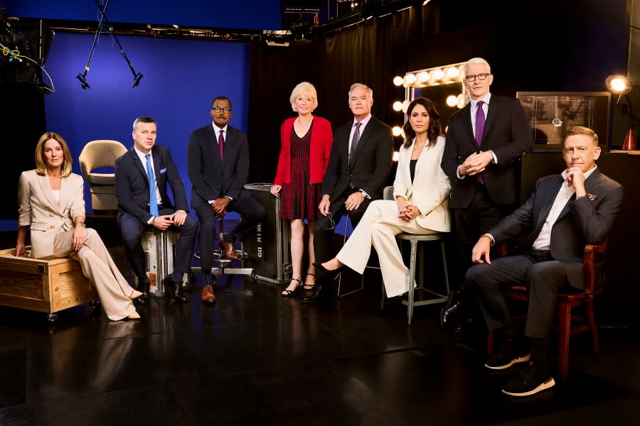 This image released by CBS News shows, from left, Sharyn Alfonsi, L. Jon Wertheim, Bill Whitaker, Lesley Stahl, Scott Pelley, Cecilia Vega, Anderson Cooper and Executive Producer Bill Owens, from the CBS news series "60 Minutes." (Jai Lennard/CBS News via AP)