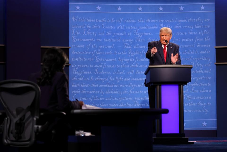 President Trump points at the moderator as he speaks onstage