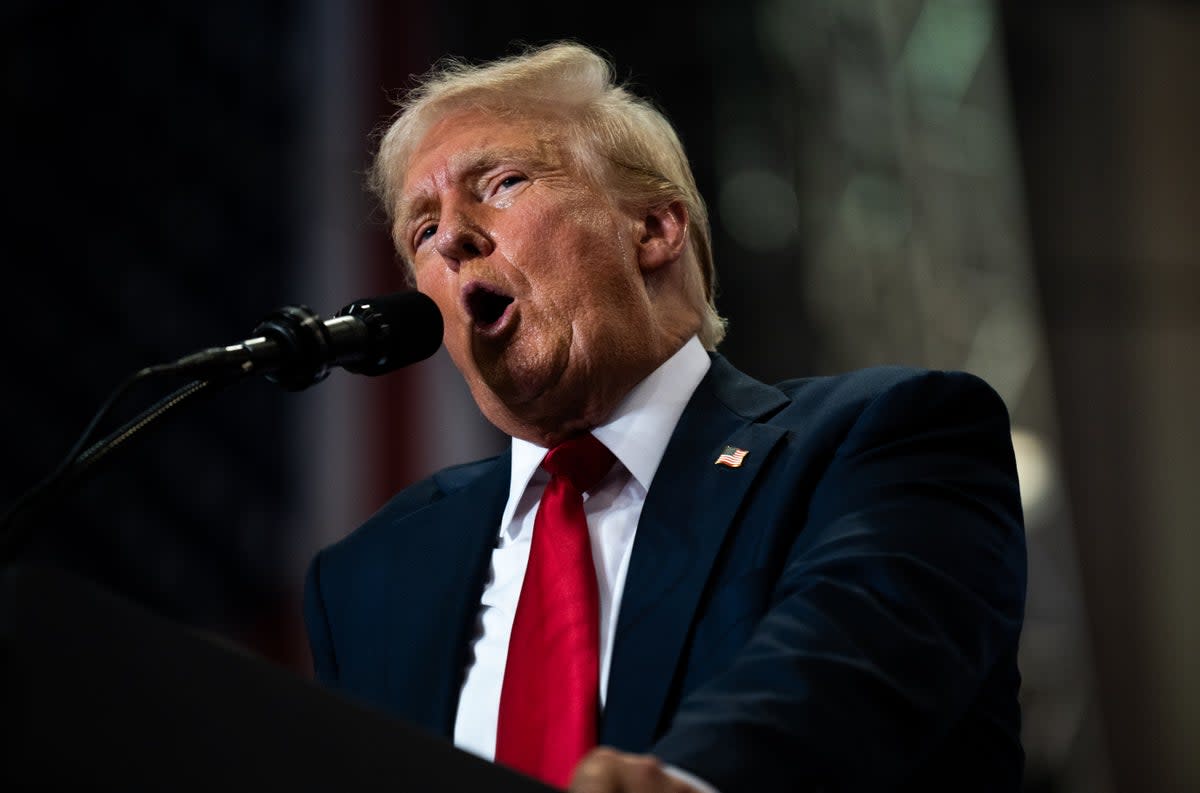 Donald Trump pictured speaking at a Minnesota rally on Saturday. His campaign bought more than $1.7m in television ads after Harris has dominated polls and headlines in recent weeks (Getty Images)