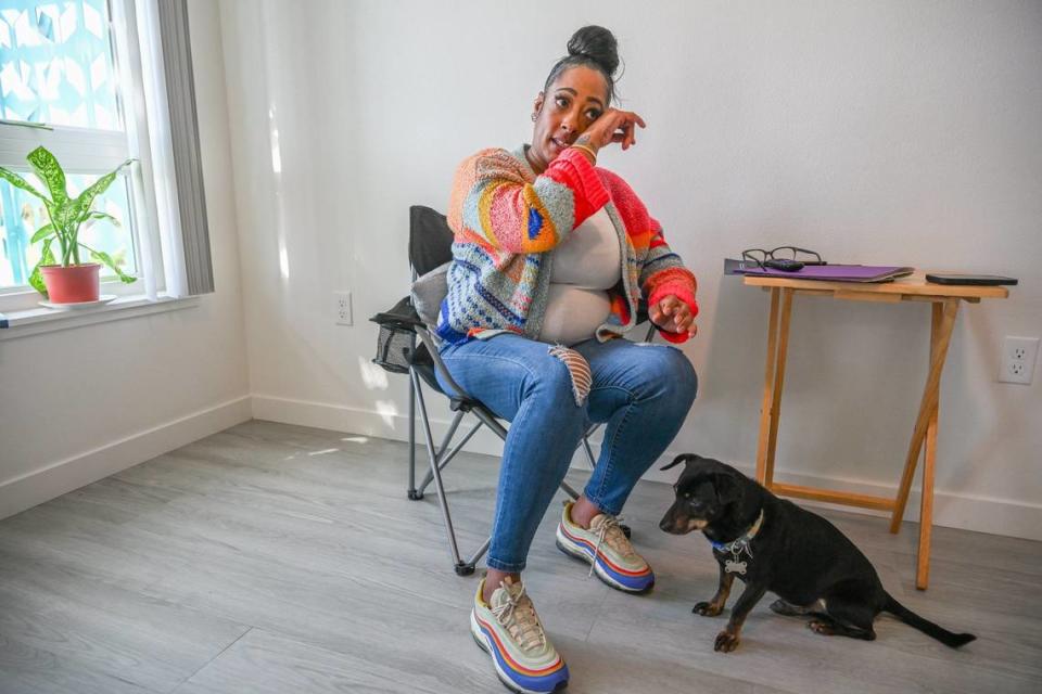 Wiping tears with her support dog Scooter nearby Shakela Wade, 43, said “I’ve never had a group of female friends, a large group of female friends in my life … they’re my sisters now,” after graduating from a nine-week Women’s Empowerment program in March.