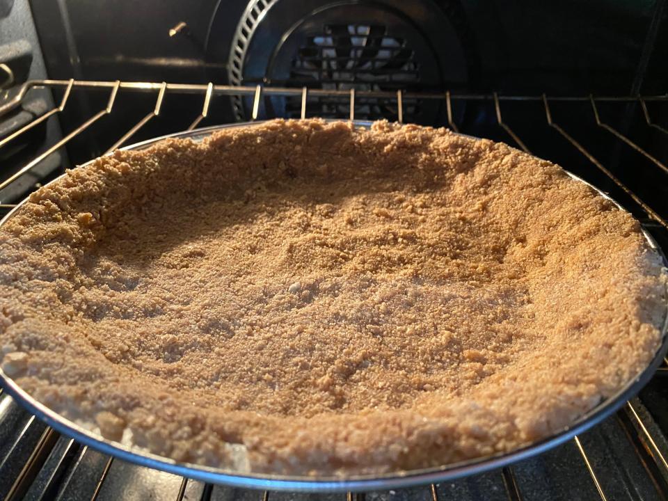 baking the crust for Bobby Flay's pumpkin pie in the oven