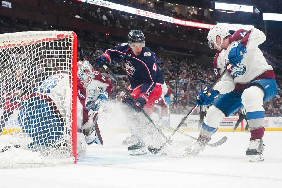 Apr 1, 2024; Columbus, Ohio, USA; Colorado Avalanche goaltender Justus Annunen (60) stops a shot from Columbus Blue Jackets center Cole Sillinger (4) during the first period of the NHL hockey game at Nationwide Arena.