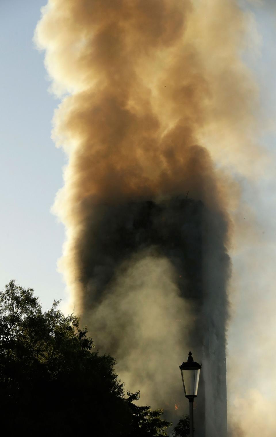 <p>Smoke rises from a building on fire in London, Wednesday, June 14, 2017. (Matt Dunham/AP) </p>