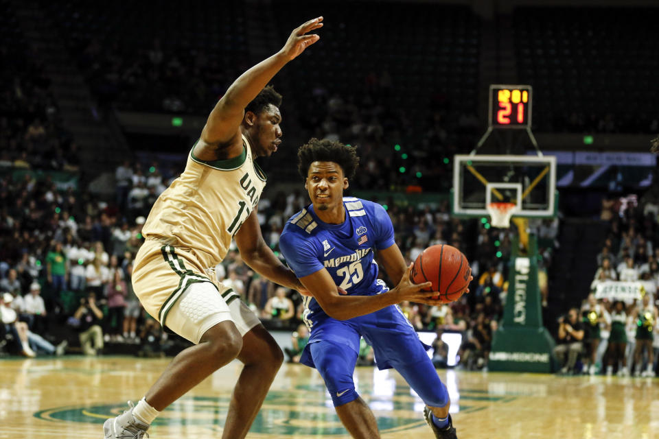 Memphis guard Jayden Hardaway (25) drives to the basket around UAB forward Will Butler (12) during the first half of an NCAA college basketball game Saturday, Dec. 7, 2019, in Birmingham, Ala. (AP Photo/Butch Dill)