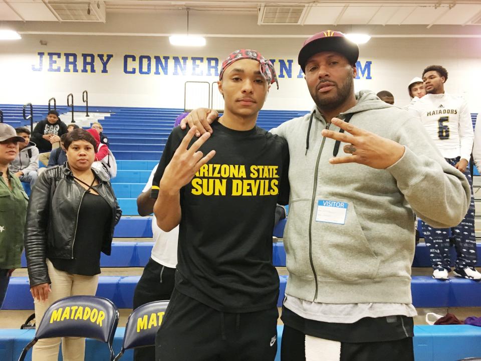 Shadow Mountain High School senior Jaelen House poses with his father Eddie, a former ASU player, during a signing ceremony on Nov. 14, 2018. Jaelen signed with ASU.