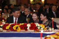 Chinese President Xi Jinping speaks with Nepalese President Bidhya Devi Bhandari at a banquet at Soltee Hotel in Kathmandu, Nepal, Saturday, Oct. 12, 2019. Xi on Saturday became the first Chinese president in more than two decades to visit Nepal, where he's expected to sign agreements on some infrastructure projects. (Bikash Dware/The Rising Nepal via AP)
