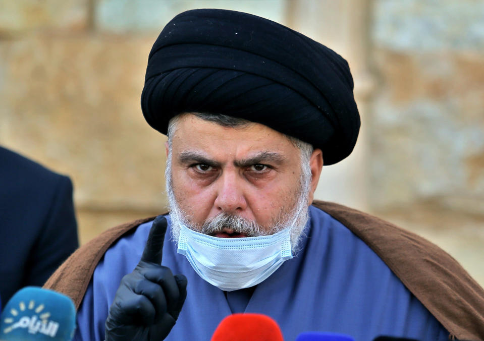 FILE - Influential Shiite cleric Muqtada al-Sadr speaks during a press conference in Najaf, Iraq, Feb. 10, 2021. Al-Sadr who's followers have been staging a sit-in outside Iraq's parliament announced his resignation from politics and the closure of his party's offices on Monday, Aug. 29, 2022. It is an unexpected plot twist more than four weeks after his supporters stormed the parliament building to prevent his Iran-backed rivals from forming a government. (AP Photo/Anmar Khalil, File)