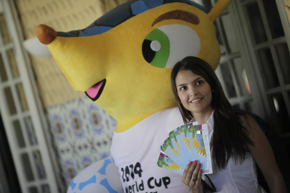 Colombia soccer fan Suzana poses after picking up her 2014 World Cup tickets in Rio de Janeiro April 18, 2014. FIFA Venue Ticketing Centres were opened in the 2014 FIFA World Cup Host Cities. REUTERS/Ricardo Moraes (BRAZIL - Tags: SPORT SOCCER WORLD CUP)