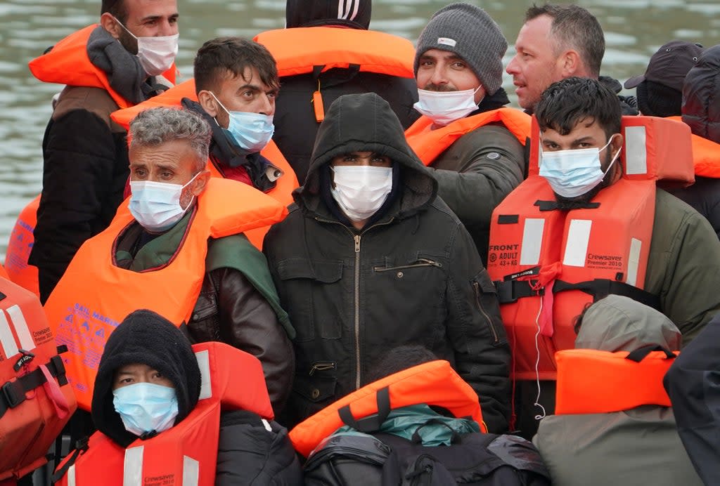 A group of people thought to be migrants are brought in to Dover, Kent, onboard a Border Force vessel on Sunday (PA) (PA Wire)