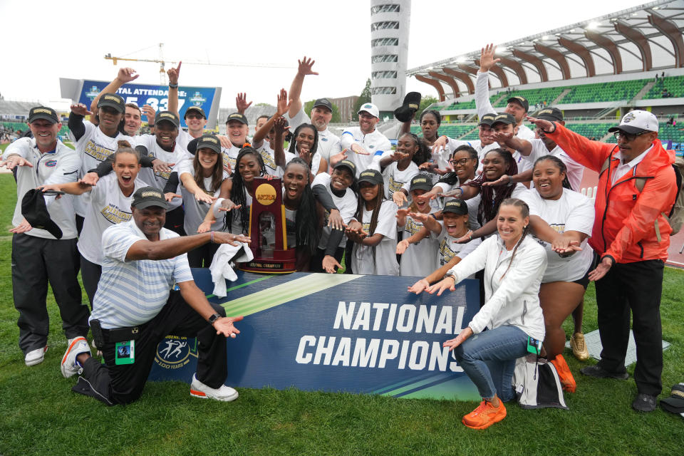 Members of the Florida women's team and coach Mike Holloway celebrate June 11, 2022, after winning the team title during the NCAA Track and Field Championships in Eugene, Ore.