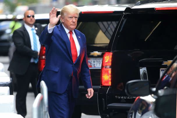 PHOTO: Former President Donald Trump waves while walking to a vehicle in New York City on Aug. 10, 2022. (Stringer/AFP via Getty Images)