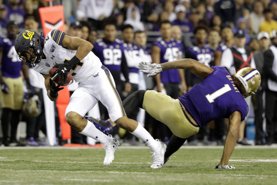 FILE - In this Sept. 7, 2019, file photo, California cornerback Camryn Bynum, left, intercepts a pass intended for Washington tight end Hunter Bryant (1) during the first half of an NCAA college football game in Seattle. Bynum changed his mind and returned to the Cal program after previously having announced he would enter the 2021 NFL draft. (AP Photo/Ted S. Warren, File)