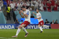 Poland's Robert Lewandowski reacts after missing a penalty during the World Cup group C soccer match between Mexico and Poland, at the Stadium 974 in Doha, Qatar, Tuesday, Nov. 22, 2022. (AP Photo/Aijaz Rahi)