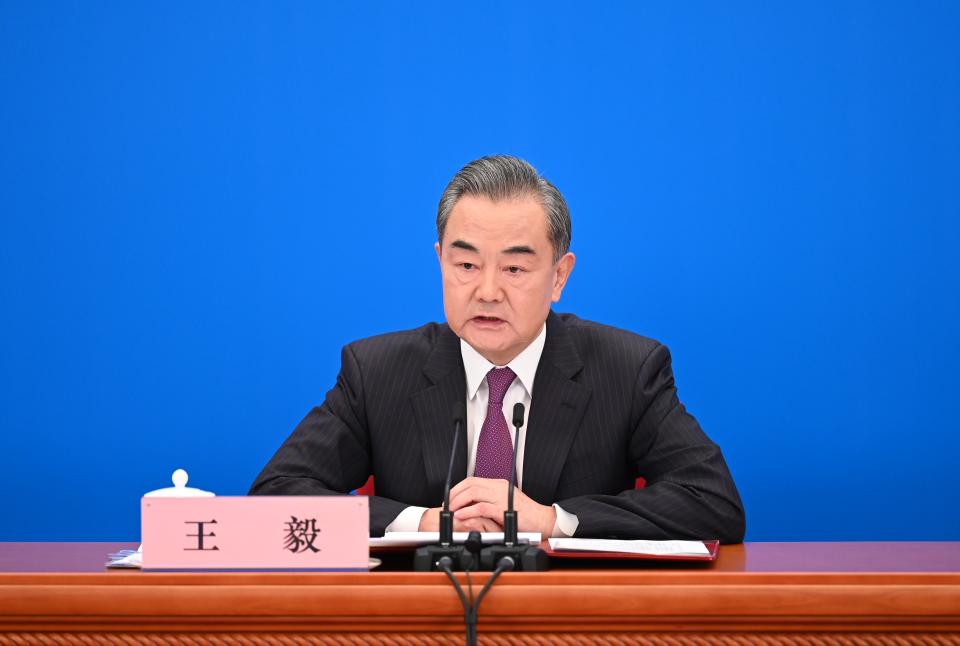 Chinese State Councilor and Foreign Minister Wang Yi speaks at a press conference.