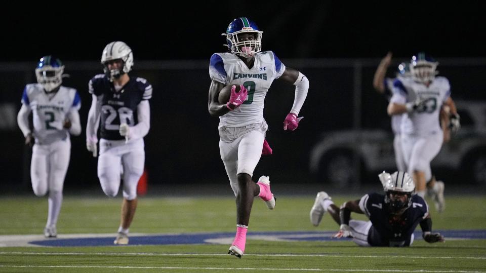 Waden Charles (9) of Somerset Academy-Canyons breaks free for a 79-yard touchdown in the second half against American Heritage-Delray on Friday, Oct. 10, 2022 in Delray Beach. 