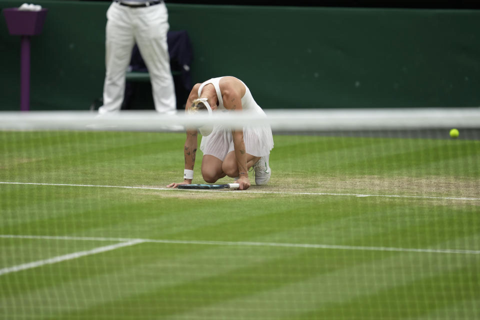 Czech Republic's Marketa Vondrousova celebrates after beating Ukraine's Elina Svitolina in the women's semifinal singles match on day eleven of the Wimbledon tennis championships in London, Thursday, July 13, 2023. (AP Photo/Kin Cheung)