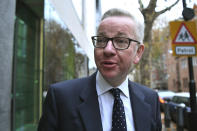 Britain's Environment Secretary Michael Gove arrives at his office in Westminster, London, Friday, Nov. 16, 2018. British Prime Minister Theresa May has had one piece of good news as she battles a rebellion within her Conservative Party. Gove has decided not to follow two other Cabinet ministers and resign over May's Brexit deal with the European Union, according to multiple media reports. (Victoria Jones/PA via AP)