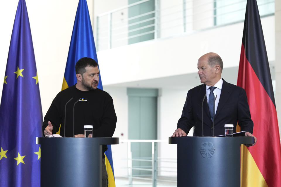 Germany's Chancellor Olaf Scholz, right, and Ukraine's President Volodymyr Zelenskyy address a media conference at the chancellery in Berlin, Germany, Sunday, May 14, 2023. Ukrainian President Volodymyr Zelenskyy arrived in Berlin early Sunday for talks with German leaders about further arms deliveries to help his country fend off the Russian invasion and rebuild what's been destroyed by more than a year of devastating conflict. (AP Photo/Matthias Schrader)