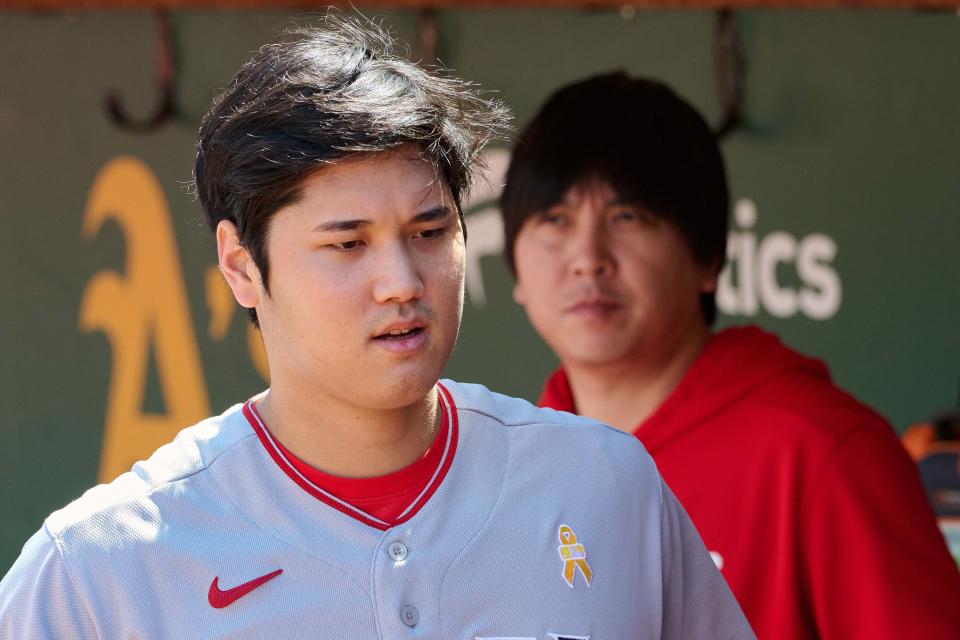 Shohei Ohtani and interpreter Ippei Mizuhara in Angels dugout in 2023.