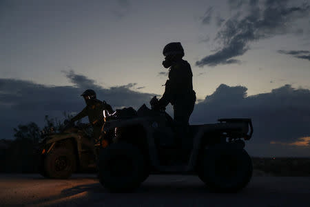 Border patrol agents use all-terrain vehicles (ATV) to search for illegal immigrants along the U.S. border with Mexico in Sunland Park, New Mexico, U.S., June 14, 2018. Picture taken on June 14, 2018. REUTERS/Adrees Latif