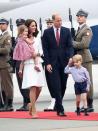 <p>The Duchess wore a white dress with a peplum as the royal family touched down in Poland to embark on the Royal Tour. She accessorized the look with nude pumps and a simple ruby necklace. </p>