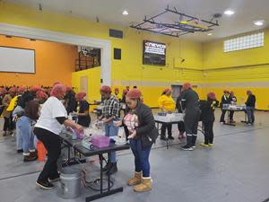 Bowie State students gather at the Theodore McKeldin Gymnasium to prepare meals