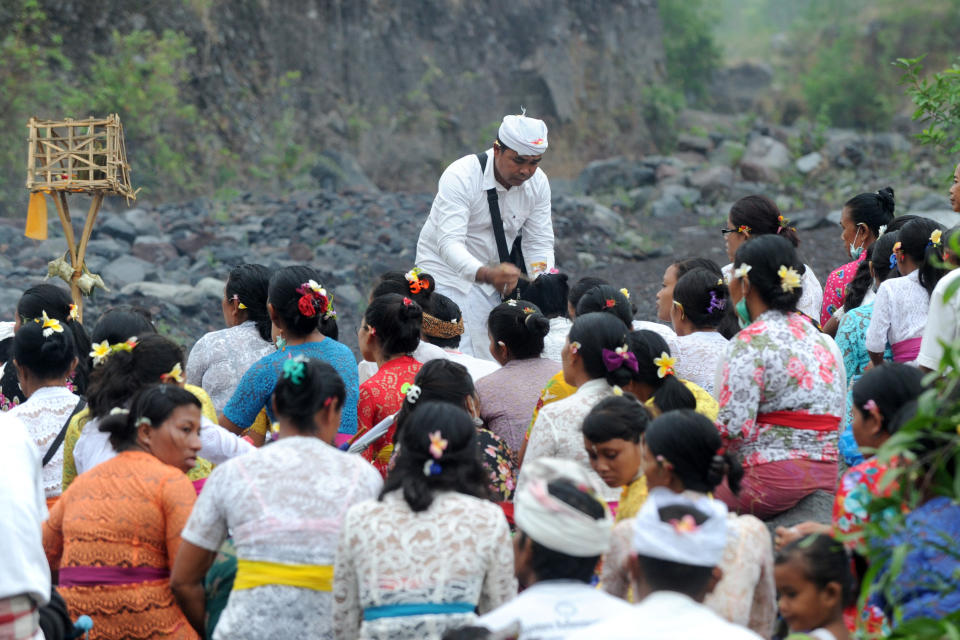 Balinese Hindus take part in a prayer ceremony near Mount Agung in hope of preventing a volcanic eruption.&nbsp;