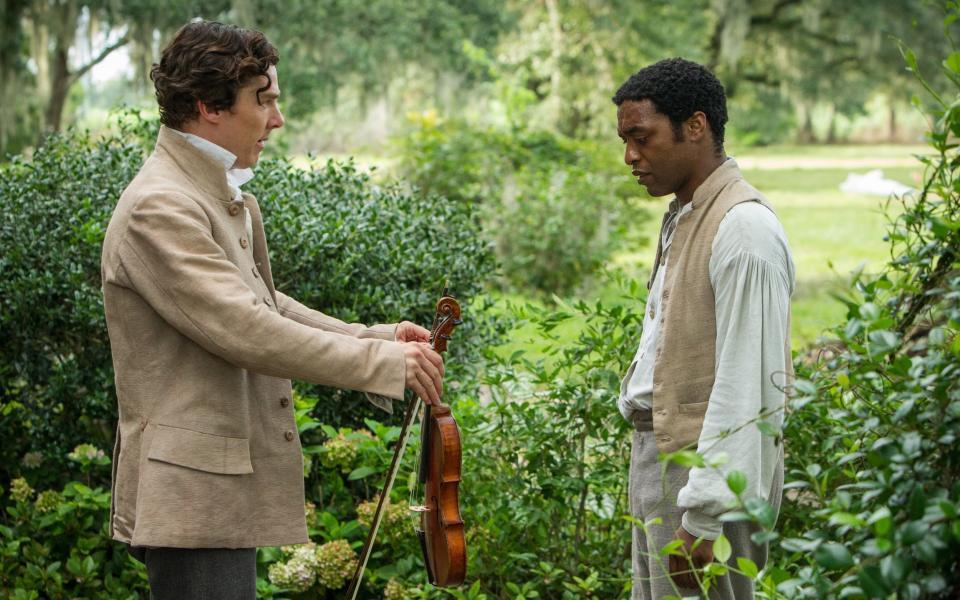 Benedict Cumberbatch (left) opposite Chiwetel Ejofor in a scene from 12 Years A Slave - Jaap Buitendijk/AP