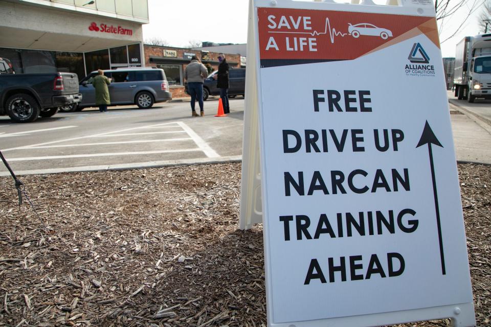 Volunteers for the Alliance of Coalitions for Healthy Communities Community Relations give a drive-thru Narcan training in front of Barbara Marten-Debenksy State Farm office in Birmingham on Feb. 26, 2021.