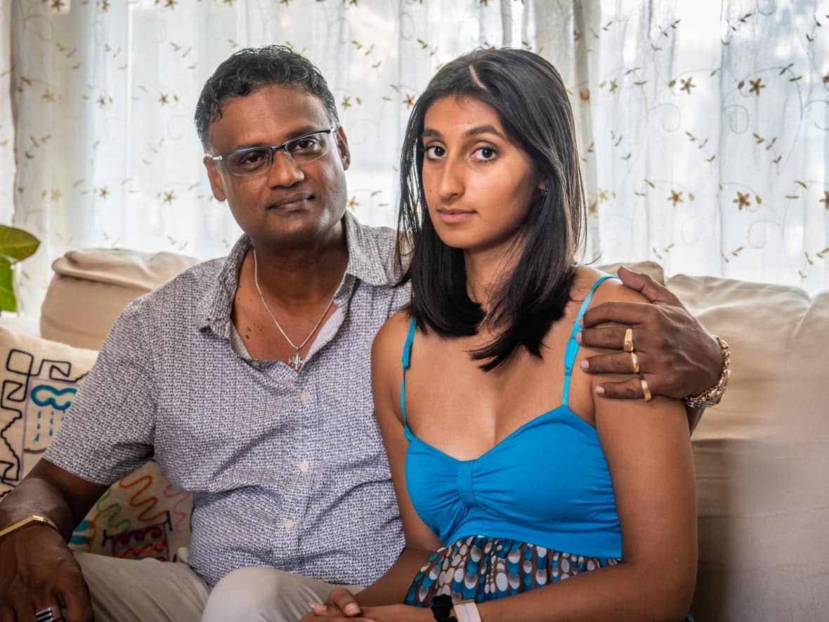 Raphael and Catherine Ready at their home on Anoka Street in Ottawa's Alta Vista neighbourhood. In late June, a former neighbour killed Anne-Marie and Jasmine Ready and seriously injured Catherine while Raphael was working in Barbados. (Michel Aspirot/CBC - image credit)