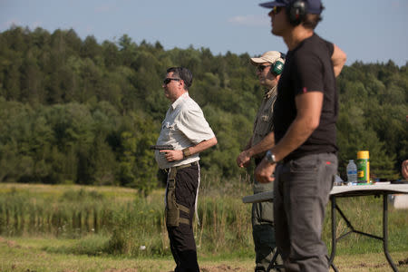 A trainee gets ready to shoot a handgun as he takes part in the Cherev Gidon Firearms Training Academy in Honesdale, Pennsylvania, U.S. August 5, 2018. REUTERS/Noam Moskowitz