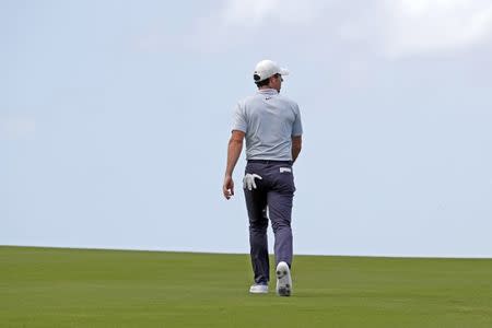 Jan 5, 2019; Maui, HI, USA; PGA golfer Rory McIlroy walks the 12th hole during the third round of the Sentry Tournament of Champions golf tournament at Kapalua Resort - The Plantation Course. Mandatory Credit: Brian Spurlock-USA TODAY Sports