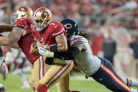 Sep 14, 2014; Santa Clara, CA, USA; San Francisco 49ers quarterback Colin Kaepernick (7) is sacked by Chicago Bears defensive end Willie Young (97) during the fourth quarter at Levi's Stadium. The Chicago Bears defeated the San Francisco 49ers 28-20. Mandatory Credit: Ed Szczepanski-USA TODAY Sports