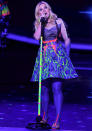 Celebrities in neon fashion: Kelly Clarkson wore this neon outfit on stage.<br><br>[Rex]