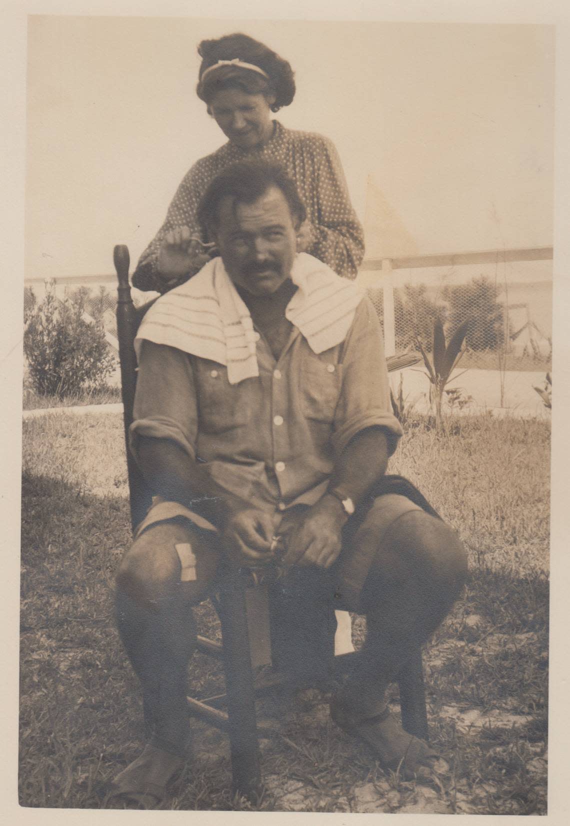 Ernest Hemingway’s second wife, Pauline Pfeiffer, cuts his hair.