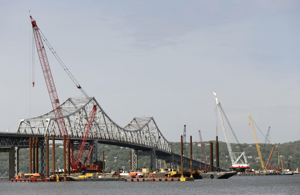 Construction crews use barges and cranes as work continues on a replacement for the 58-year-old Tappan Zee Bridge spanning the Hudson River, Tuesday, May 13, 2014, near Tarrytown, N.Y. On Wednesday, President Barack Obama plans to speak by the bridge just north of New York City to press his case that a key federal government fund used to pay for the nation's roads, bridges and ports is running dry and that the economy would be damaged if it is not replenished. (AP Photo/Julie Jacobson)