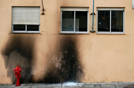 Damage caused by molotov cocktails is seen on the police station building at the Bela Vista neighborhood in Setubal, Portugal January 22, 2019. REUTERS/Rafael Marchante